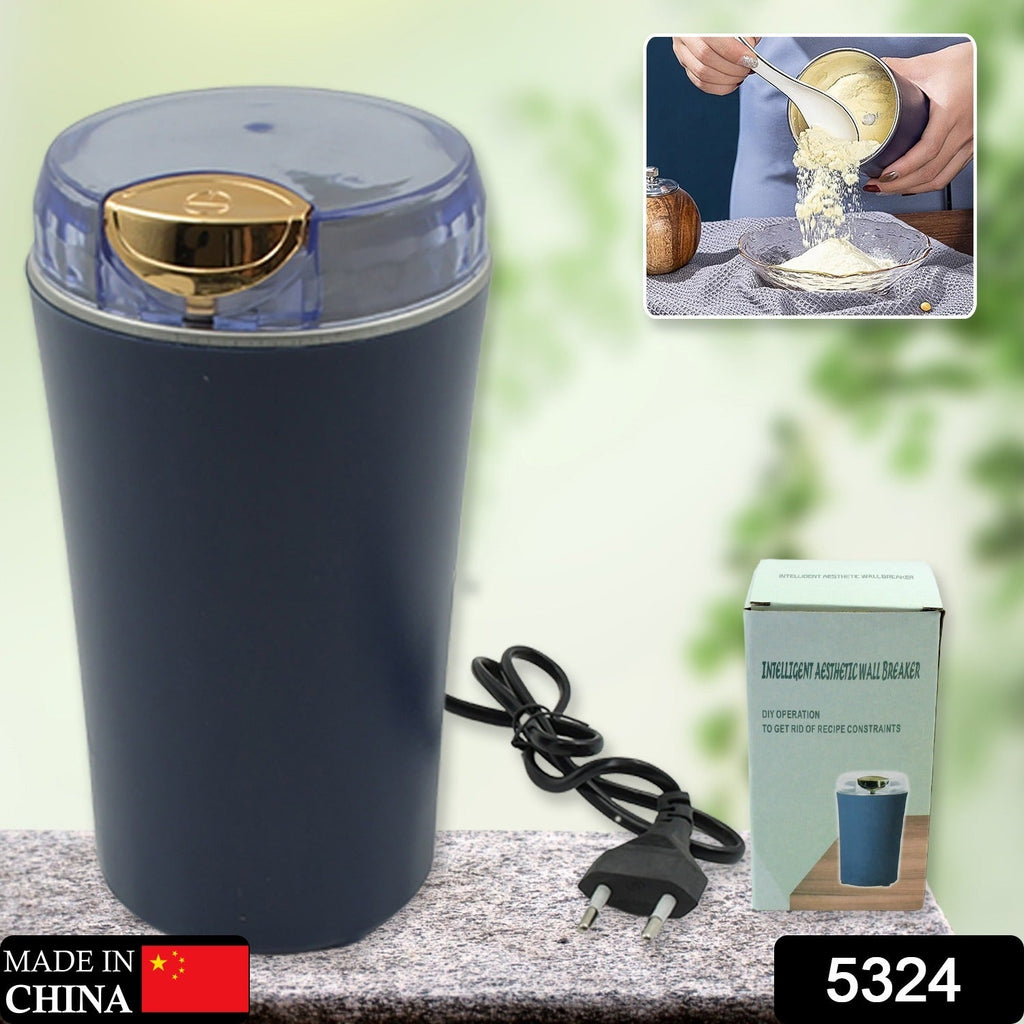 Hand holding the compact portable coffee grinder blender for scale.