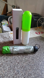 Sleek and compact foldable UV umbrella in its case, ideal for bags.