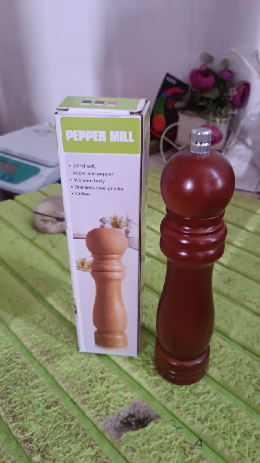 Generic product image of a wooden pepper grinder against a clean, white backdrop.