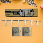 The utensil hanger rail mounted on a kitchen wall, neatly holding various kitchen ladles and tools.