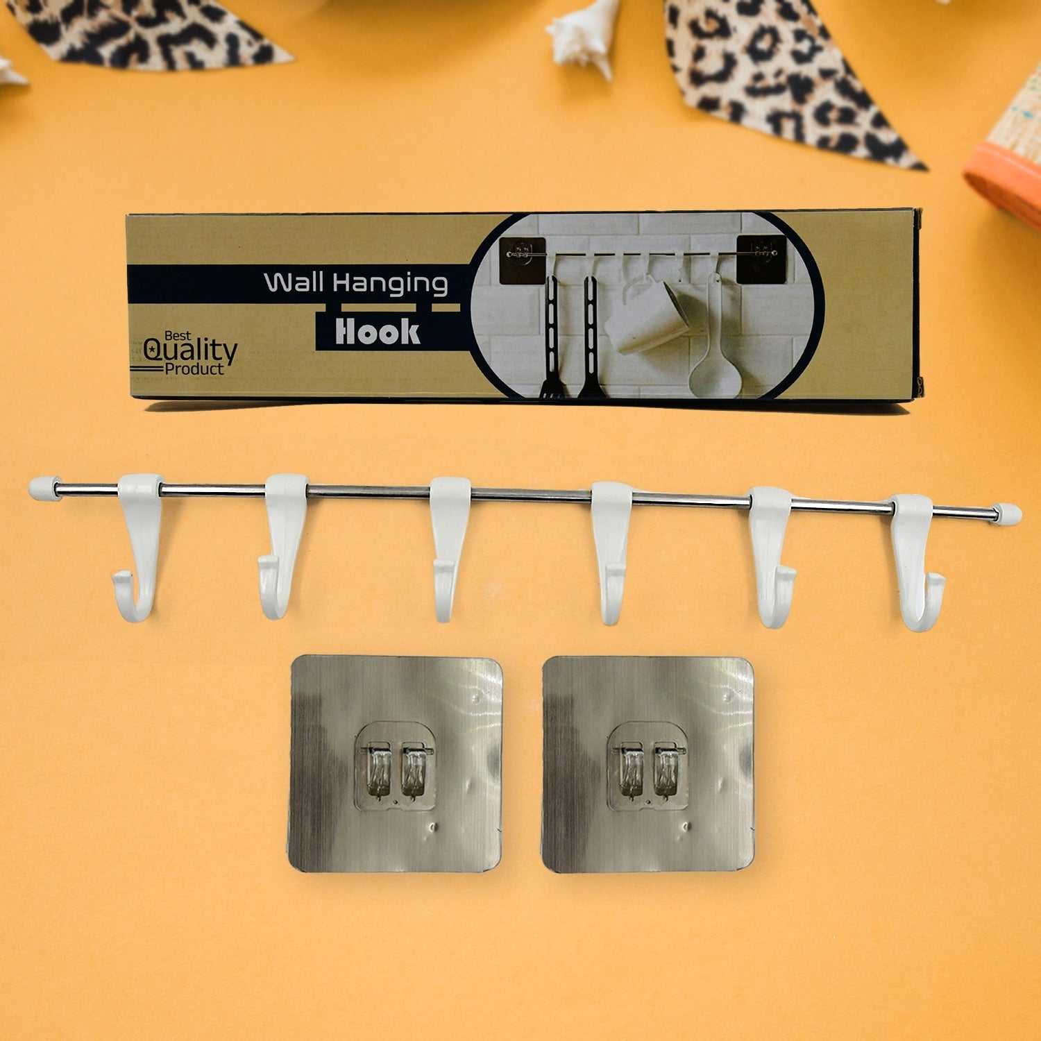 The utensil hanger rail mounted on a kitchen wall, neatly holding various kitchen ladles and tools.