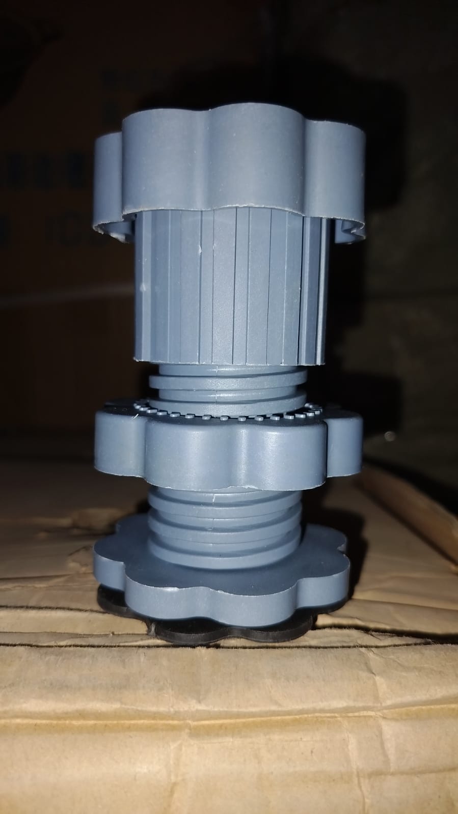 Washing machine lifted by Garth anti-skid pads, demonstrating enhanced stability and floor protection.