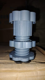Washing machine lifted by Garth anti-skid pads, demonstrating enhanced stability and floor protection.