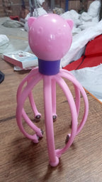 Octopus-shaped electric scalp massager presented on a clean background.