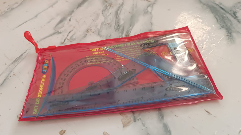 Close-up of transparent geometry instruments in use showing accuracy and clear markings