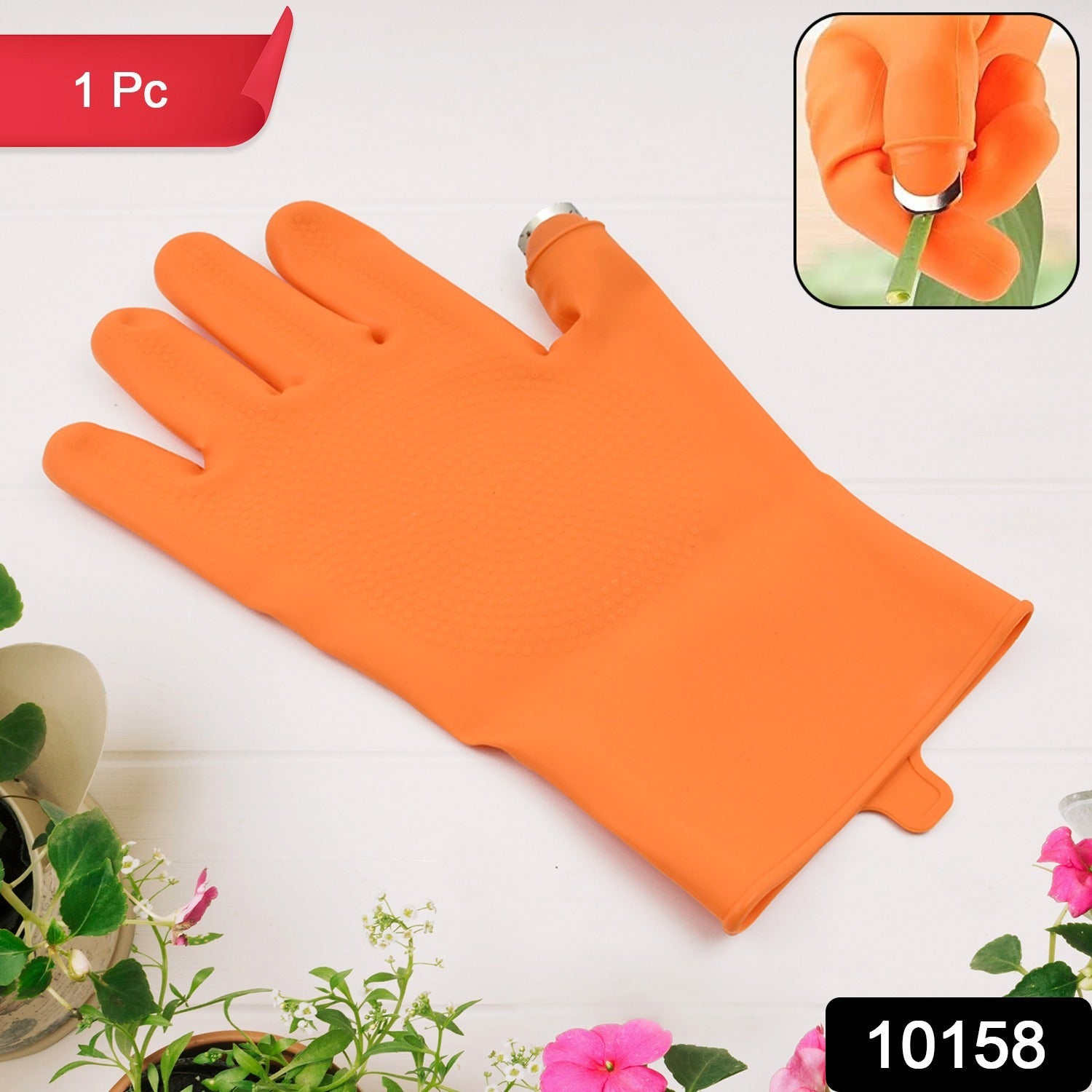 Right-Handed Thumb Cutter Glove being used to harvest a red chilli pepper from a plant.