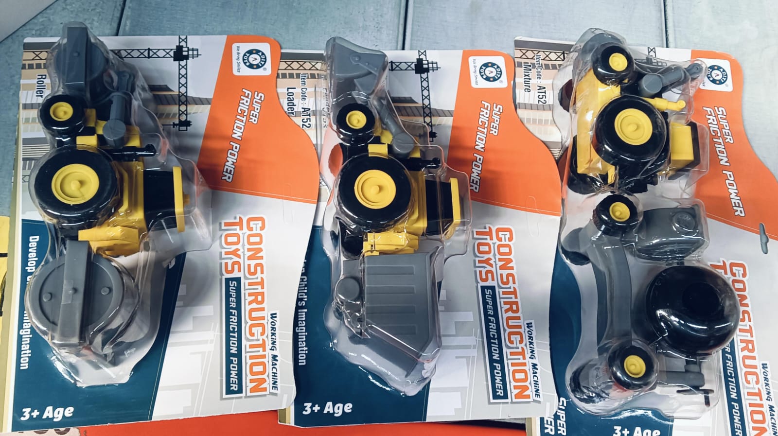 Instruction manual and parts layout for assembling the mini excavator toy.