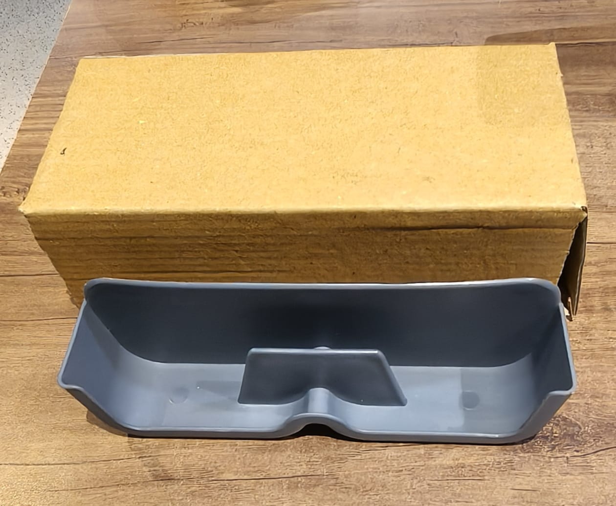 Sunglasses holder mounted on wall beside door for easy access