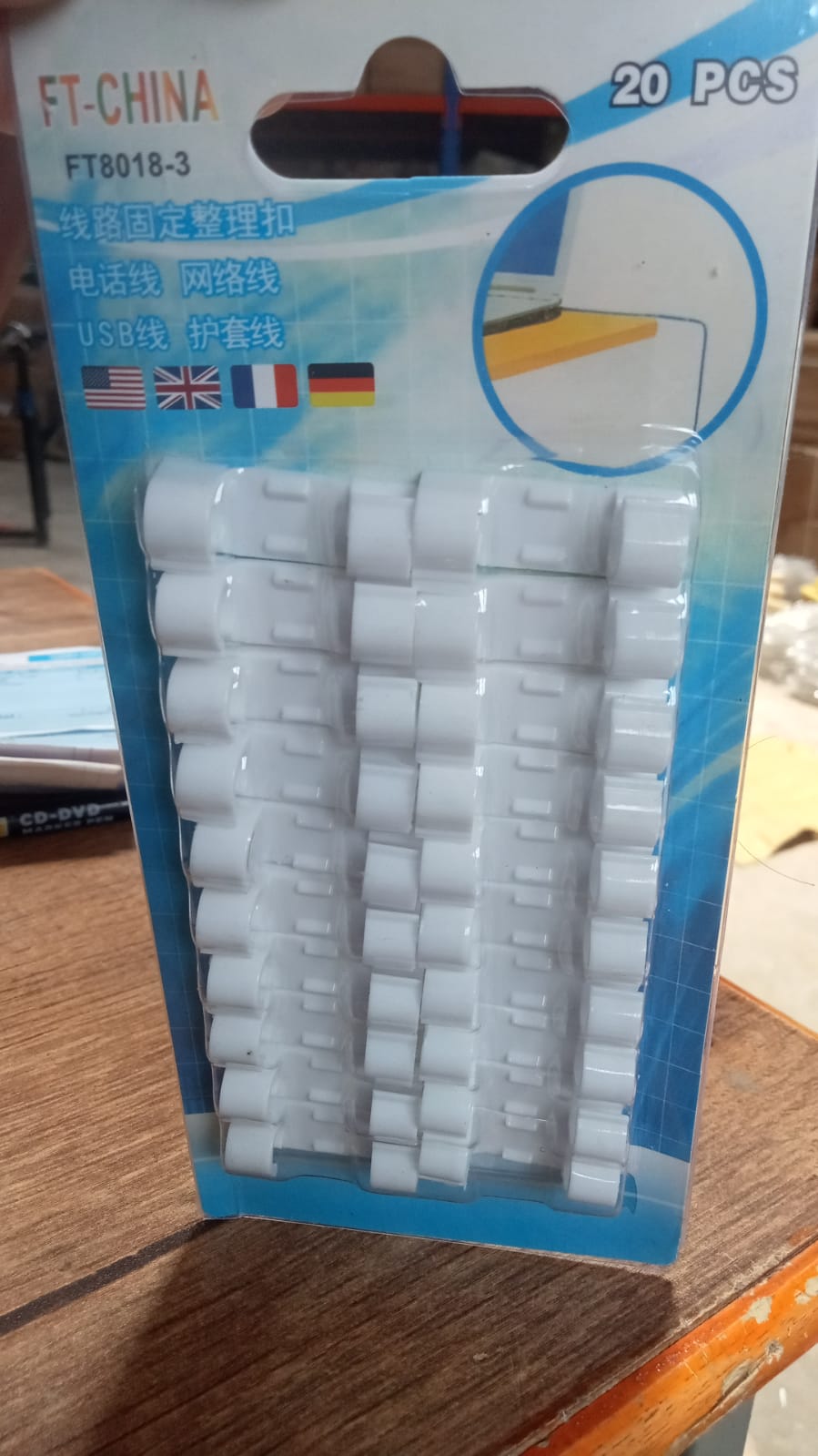 A close-up view of the round sticky cable clips, highlighting their strong adhesive.