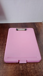 Ergonomic hard plastic clipboard with snap lock closure ideal for students and office use