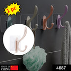 Multiple self adhesive wall hooks demonstrating strong backing for heavy-duty hanging.