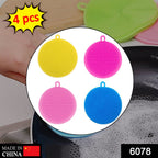 Vibrant silicone scrubber sponge in hand, showcasing its mildew-resistant and non-stick design.