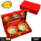 Close-up of the exquisite gold and silver plated brass serving set, featuring bowls and spoons.