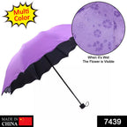 An open Magic Umbrella revealing vibrant peach blossoms under simulated rain.