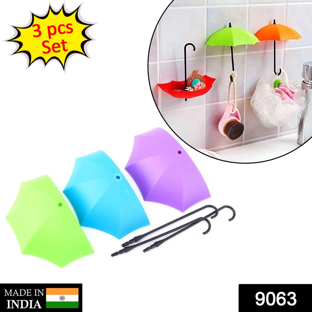 Colorful umbrella wall hook neatly organizing keys and small accessories on a plain wall.