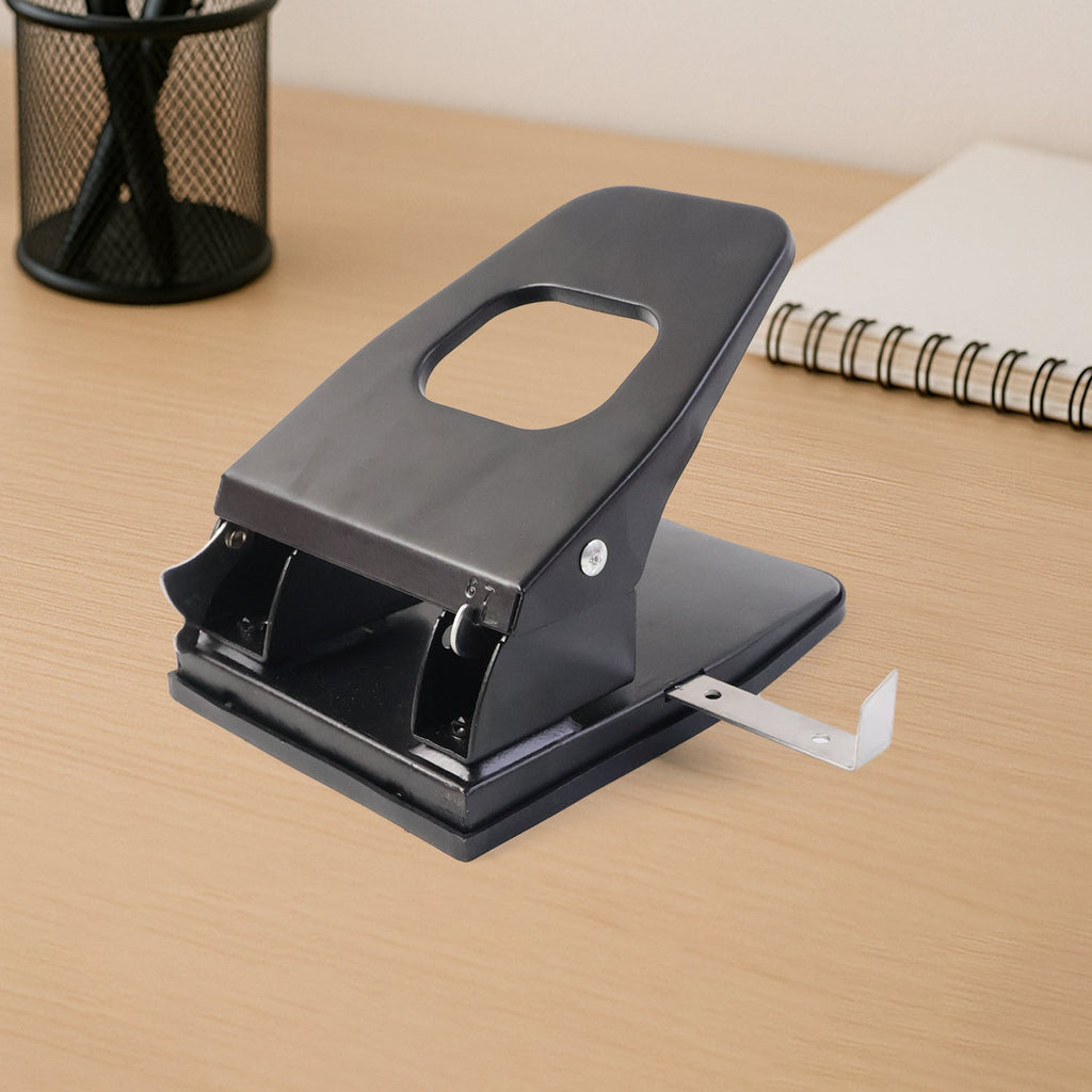 Demonstration of punching tool with ergonomic handle on paper punch