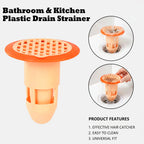 Clear plastic drain strainer positioned in kitchen sink drain opening