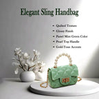 Mini fashion handbag highlighted by a decorative pearl handle and chain strap