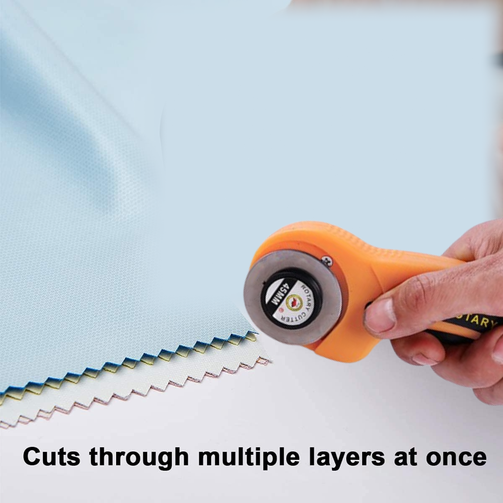 Close-up of rotary cutter's sharp blade and comfortable grip