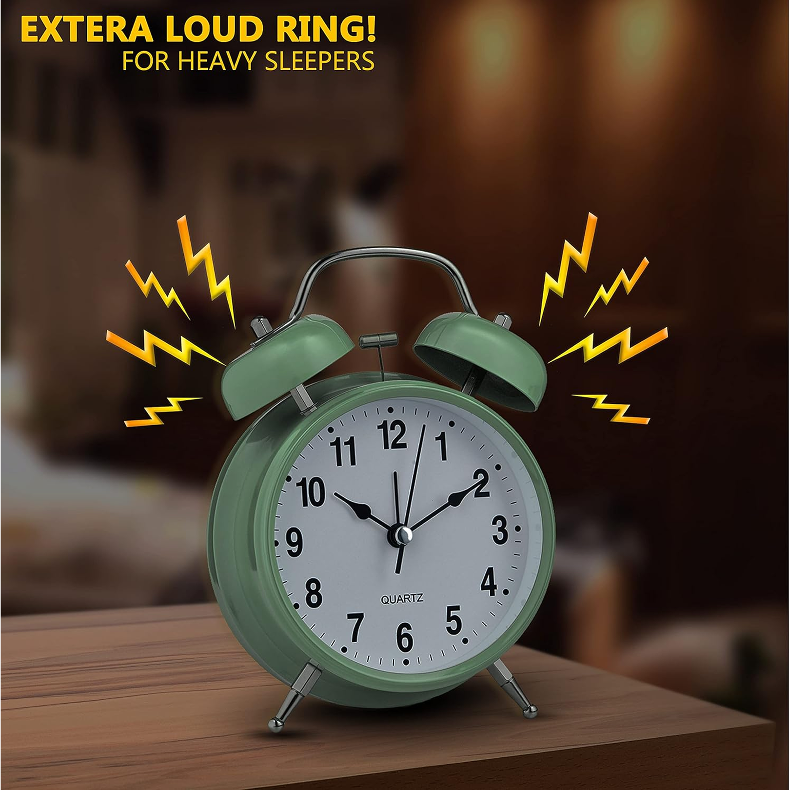 Hand holding the compact twin-bell analog alarm clock for scale.