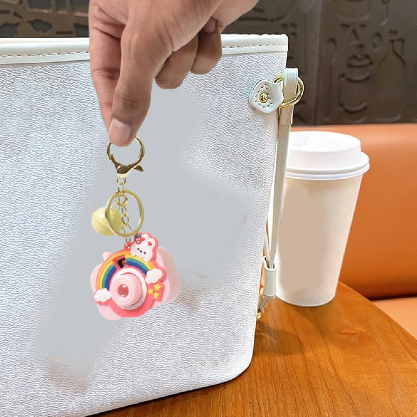 Projective camera keychain attached to a key holder showcasing style
