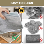 Durable stainless steel scrubber removing tough grime from a kitchen surface.