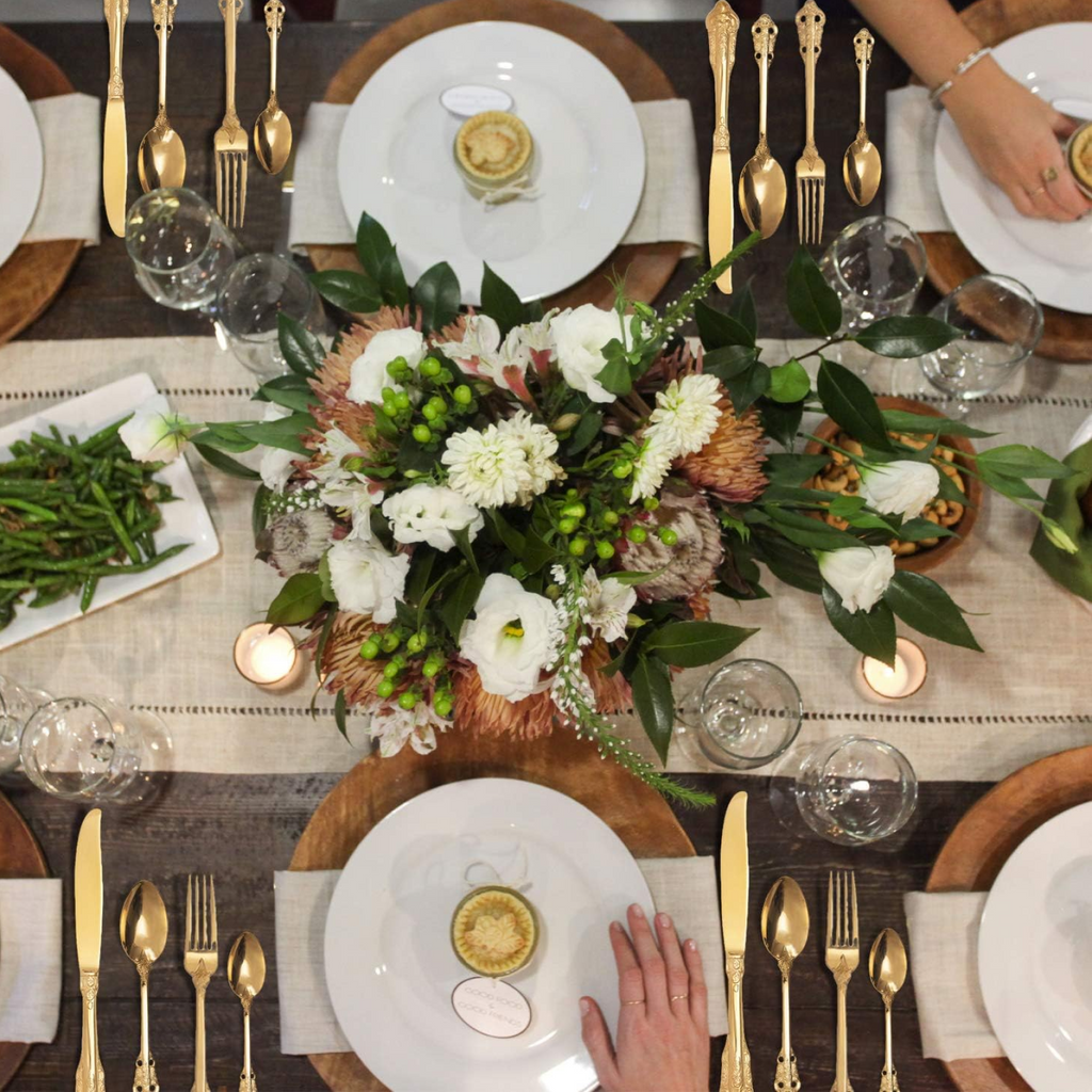 Shining golden dessert spoons from the complete 24-piece cutlery collection.