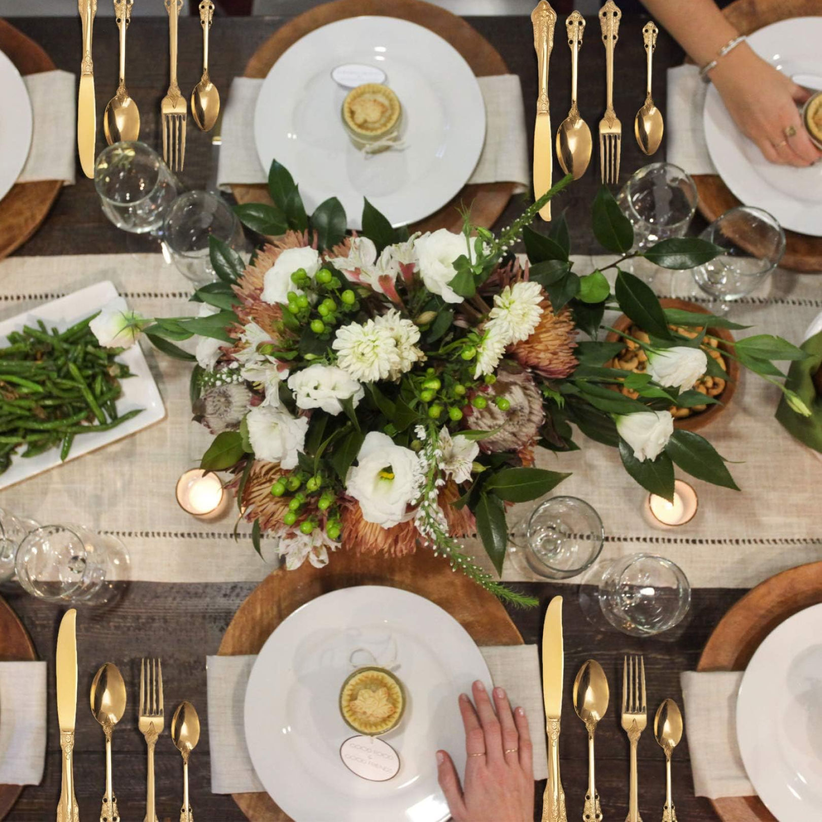Shining golden dessert spoons from the complete 24-piece cutlery collection.