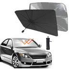 Foldable car sunshade in use, deployed on a car's windshield to block sun.