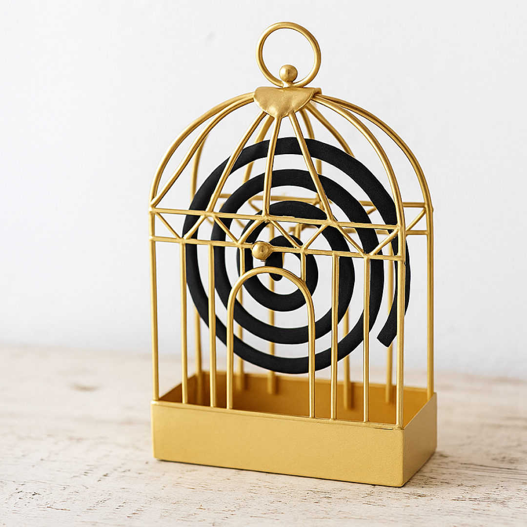 Close-up of the intricate metalwork on the vintage mosquito coil holder.