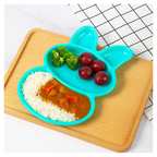 Side view demonstrating the shallow depth of the children's rabbit dishes.