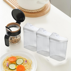Three transparent kitchen storage jars neatly stacked to save pantry space.
