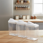 Close-up of the sliding lid mechanism on a transparent kitchen storage jar.