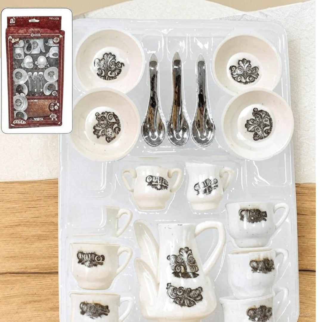 Assorted miniature plastic spoons and accessories for the toy tea set.