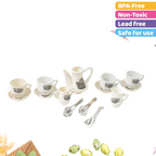 Close-up of a miniature plastic tea kettle and milk pitcher for pretend play.