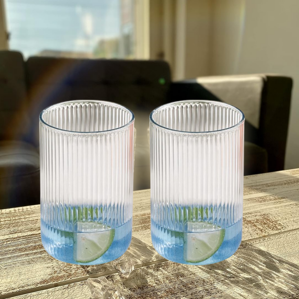 Full set of six Supermom plastic ribbed tall glasses on table