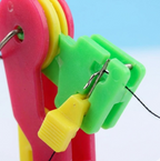 Ergonomic side view of the compact automatic needle threading tool.