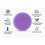 Silicone dish scrubber gently cleaning a delicate glass without scratches.