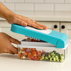 All detachable components of the blue Ganesh 7-in-1 vegetable cutter laid out.