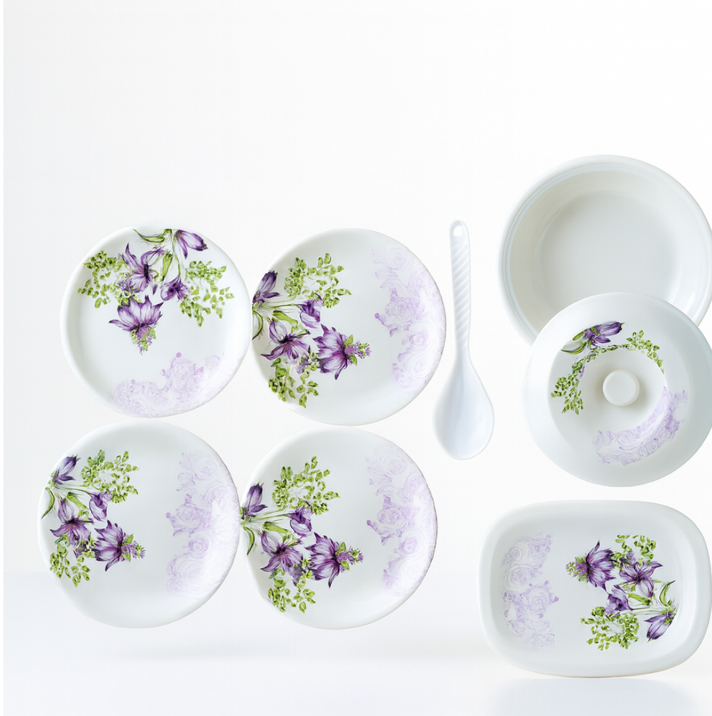 Full view of the 32-piece plastic tableware set, featuring plates, bowls, and serving dishes.