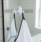 Detail of the strong suction cups used to secure the beard apron to a mirror.