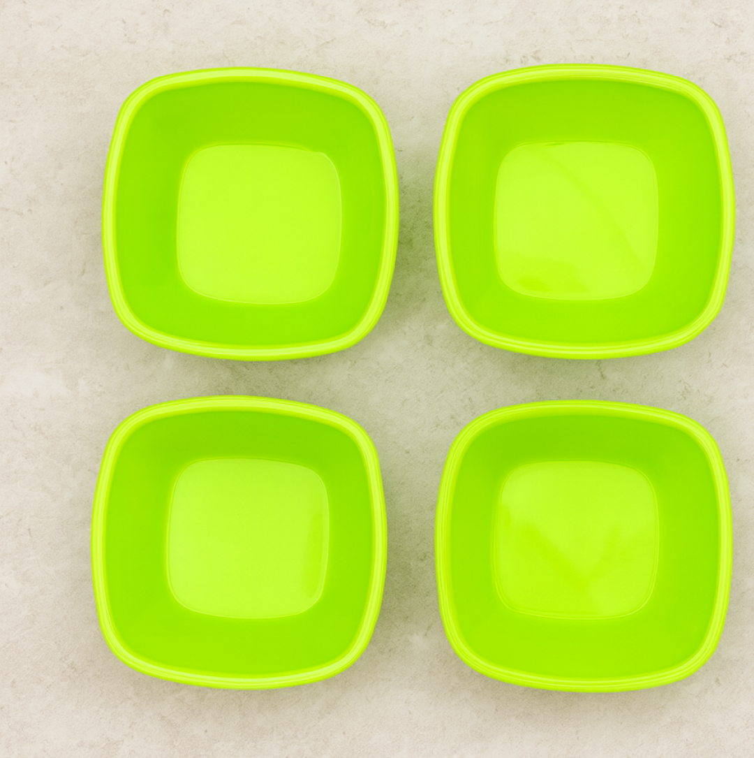 Stylish square plastic bowls displayed in a modern kitchen setting.