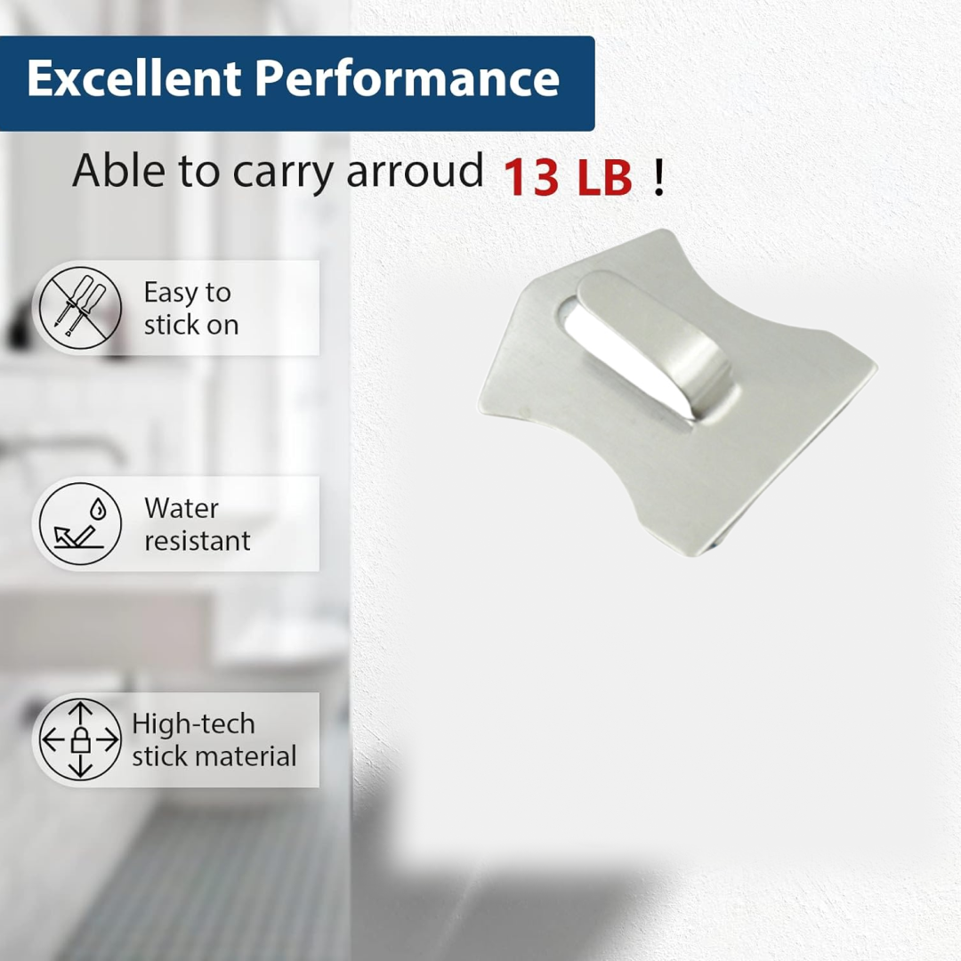 Stainless steel wall hooks organizing kitchen utensils and towels efficiently.