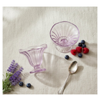 A stack of clear plastic ice cream bowls demonstrating their compact storage.