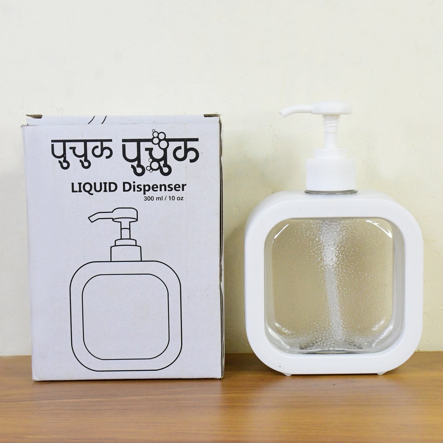 Additional view of the empty clear plastic pump bottle for soap or lotion.