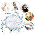 Compact USB mini washing machine on white background