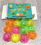 LED puffer ball toy illuminating in a dark room