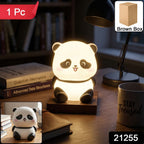 Mini panda LED night lamp on bedside table