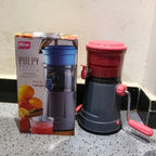 Manual fruit juicer with ergonomic handle designed to reduce effort