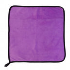 Multi-purpose purple microfiber cleaning cloth on surface